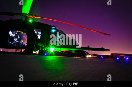 U.S. Air Force aircrew members and pararescuemen with the 26th Expeditionary Rescue Squadron perform preflight inspections on m Stock Photo