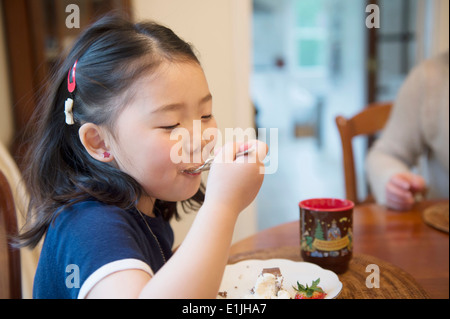 Girl eating cake Stock Photo