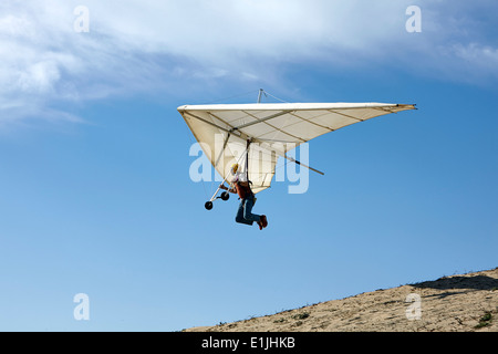 Man flying hang glider Stock Photo
