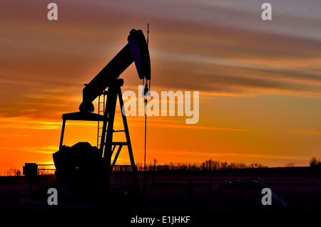 A horizontal image of a working Pump Jack Stock Photo