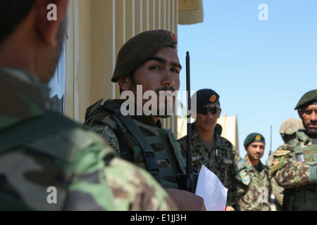 An Afghan National Army soldier with the 201st Corps conducts a mission brief during a simulated training exercise at Forward O Stock Photo