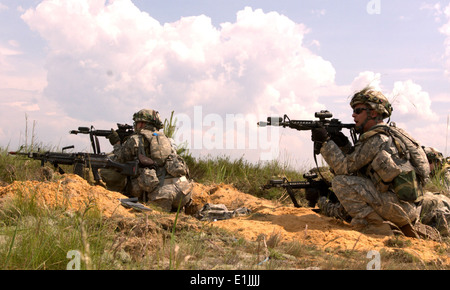 U.S. Soldiers with the Pennsylvania Army National Guard repel an attack by opposition forces during a situational exercise in & Stock Photo