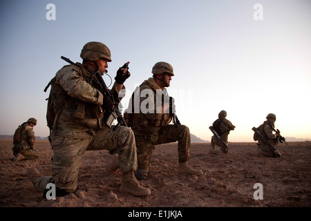 Georgian soldiers assigned to Charlie Company, 33rd Light Infantry Battalion coordinate their movements toward an objective dur Stock Photo