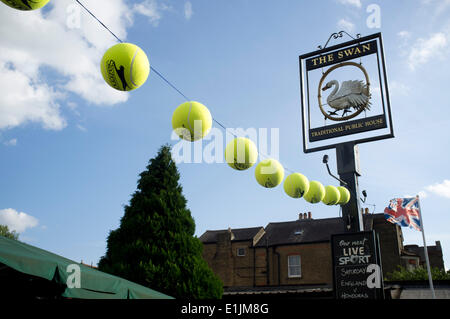 Wimbledon London,UK. 5th June 2016. A woman relaxes on a park bench ...