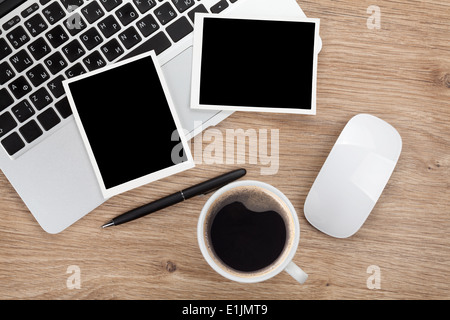 Blank instant photo frames over office table. View from above Stock Photo