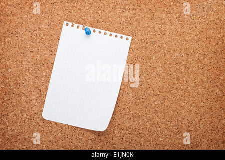 Blank notepad paper on cork wood notice board with copy space Stock Photo