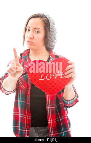 Young woman holding heart shape with pointing Stock Photo