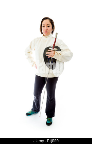 Female fencer standing with her hand on hip Stock Photo