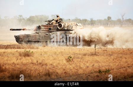 U.S. Marines with Alpha Company, 1st Tank Battalion, 1st Marine Division ride in an M1A1 Abrams tank to an objective during exe Stock Photo