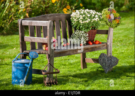 Garden bench with autumn decoration Stock Photo