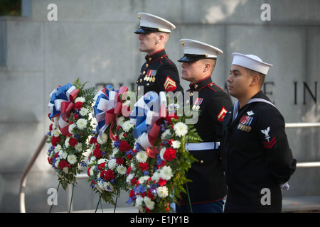 From left to right, U.S. Marine Corps Cpl. Gerrett Ogle, Lance Cpl. Stephen Carrera, and U.S. Navy Petty Officer 2nd Class Arma Stock Photo