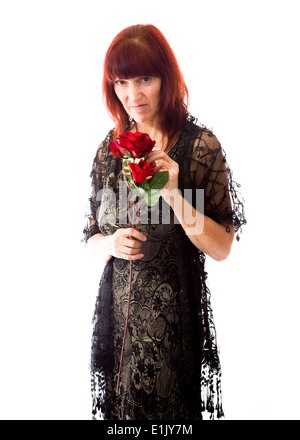 Mature woman rejected flower Stock Photo