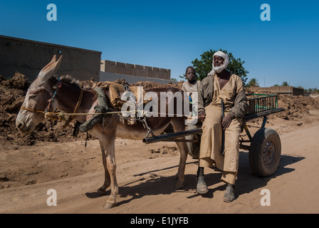 Man with son on the donkey cart, Kerma, northern Sudan Stock Photo