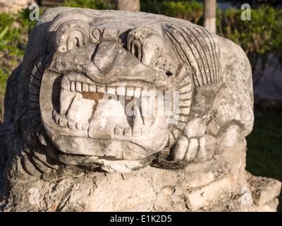 Mayan Style Sculpture of a growling lizard at Tulum City Hall. Cast concrete sculptures. Stock Photo