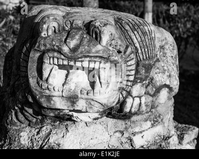 Mayan Style Sculpture of a growling lizard at Tulum City Hall. Cast concrete sculptures. monochrome Stock Photo