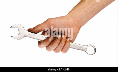 Close-up shot of a hand holding a wrench, isolated on white. Stock Photo