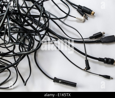 Tangle of leads with different connectors Stock Photo