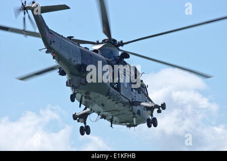 Portsmouth, Hampshire, UK. 05th June, 2014.The Royal Marines stage a modern day landing at southsea common with a sea king helicopter. Credit:  Scott Carruthers/Alamy Live News Stock Photo