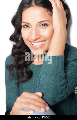 MODEL RELEASED Portrait of a woman wearing a green jumper. Stock Photo