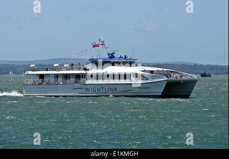 Portsmouth, Hampshire, UK. 05th June, 2014. © Scott Carruthers/Alamy a catamaran returns from isle of wight Stock Photo