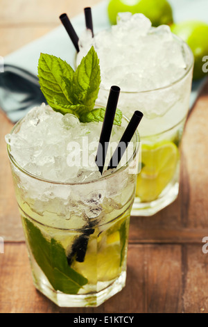 Mojito cocktail with ingredients on wooden background Stock Photo