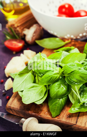 Basil and ingredients for making italian pasta Stock Photo