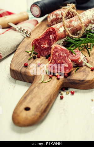 Italian salami and wine on white background Stock Photo