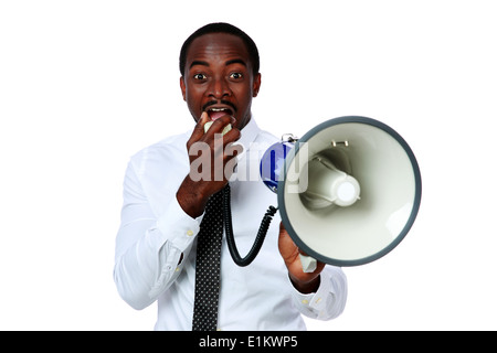 African man yelling through a megaphone isolated on a white background Stock Photo