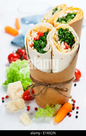 tortilla wraps with chicken and fresh vegetables isolated on white Stock Photo