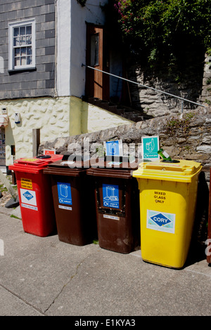 Coloured Recycling Bins in quayside in the cornish seaside village of Mevagissey Stock Photo