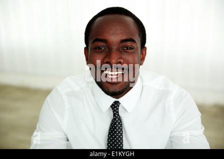 Portrait of a laughing african man in office Stock Photo