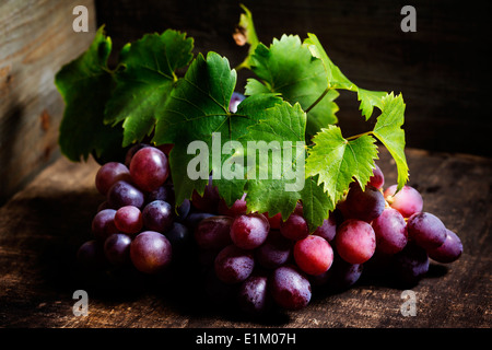 Red grape on wooden background Stock Photo