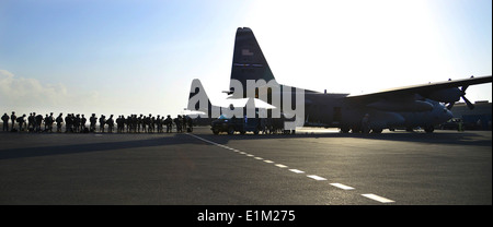 U.S. Soldiers assigned to the East Africa Response Force (EARF), a Djibouti-based joint team, prepare to board an Air Force C-1