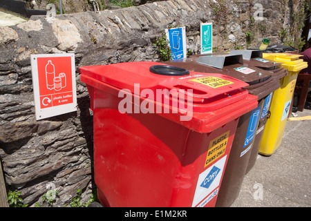 Coloured Recycling Bins in quayside in the cornish seaside village of Mevagissey Stock Photo