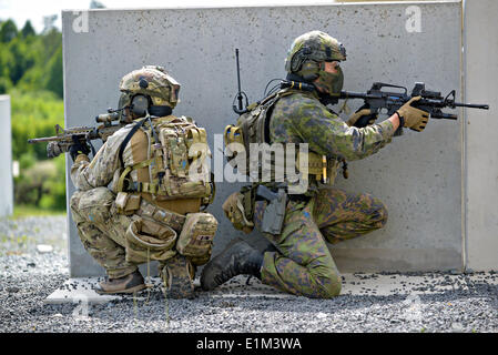 Special operation forces from nine different nations participate in the International Special Training Center advanced close quarter battle course at the 7th Army Joint Multinational Training Command June 5, 2014 at Grafenwoehr Training Area, Germany. Stock Photo