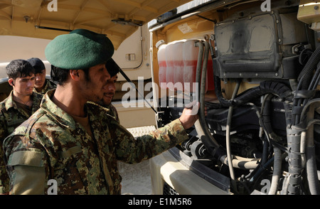 Afghan National Army (ANA) soldiers with the 201st Corps perform preventive maintenance checks and services on a dump truck Jan Stock Photo