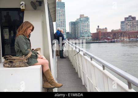 Commuters on the East River Ferry, NYC Stock Photo