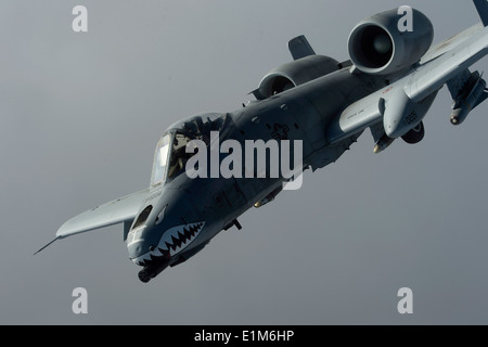 A U.S. Air Force A-10 Thunderbolt II aircraft attached to the 74th Expeditionary Fighter Squadron flies in a combat sortie over Stock Photo