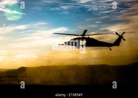 An MH-60 Black Hawk with the 160th Special Operations Aviation Regiment provides air support for Army Rangers with 2nd Battalio Stock Photo