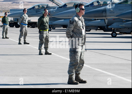 U.S. Air Force crew chiefs with the 140th Aircraft Maintenance Squadron, Colorado Air National Guard wait for the signal to lau Stock Photo