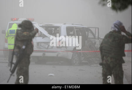 Kabul, Afghanistan. 6th June, 2014. People look at the explosion site ...