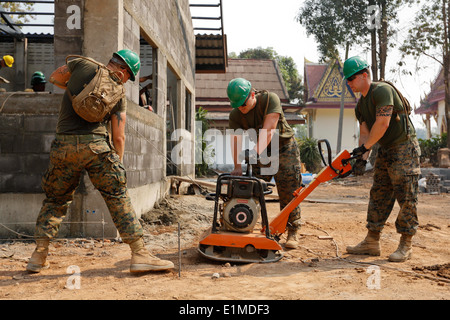 From left, U.S. Marine Corps Lance Cpl. Stan Wright, Cpl. Andrew O'Malley and Lance Cpl. Patrick Thompson, all engineers with t Stock Photo