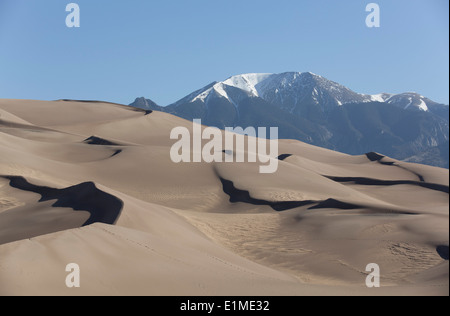 USA, Colorado, Great Sand Dunes National Park and Preserve, sand dunes (foreground), Sangre De Cristo Mountains (background) Stock Photo