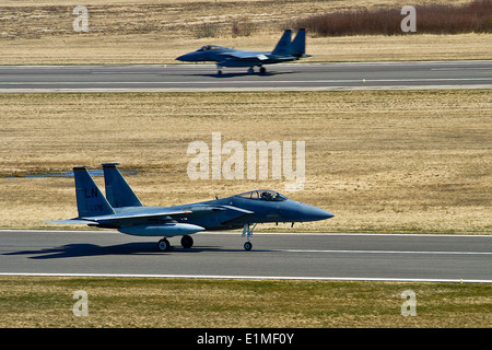 Two U.S. Air Force F-15C Eagle aircraft attached to the 493rd Expeditionary Fighter Squadron taxi during a regional training ev Stock Photo