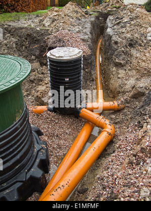 self building house, drainage pipes being connected to gully at rainwater harvesting tank Stock Photo