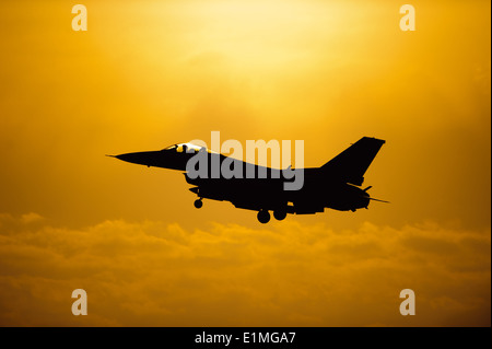 A U.S. Air Force F-16 Fighting Falcon aircraft assigned to the 80th Fighter Squadron prepares to land after completing a sortie Stock Photo