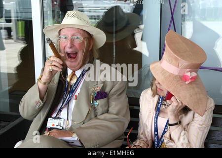 Epsom Downs, Surrey, UK. 06th June, 2014. the controversial ex TV pundit JOHN McCRICK and wife at The Oaks, Epsom Dwns Credit:  Motofoto/Alamy Live News Stock Photo