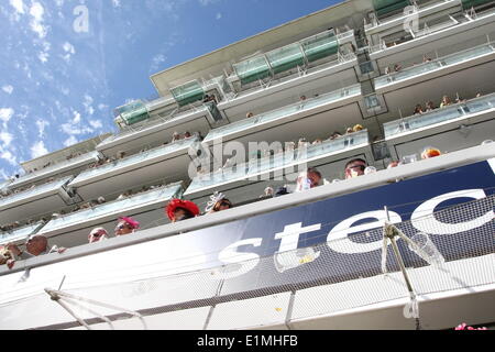 Epsom Downs, Surrey, UK. 06th June, 2014. Hooligan punters hang over the edges of their grandstand boxes  at The Oaks, Epsom Dwns Credit:  Motofoto/Alamy Live News Stock Photo