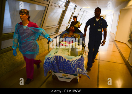 Israeli medics transport U.S. Army Pfc. James Black, a multichannel radio operator maintainer assigned to the 44th Expeditionar Stock Photo