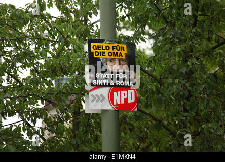 An election poster for the radical German rightwingers party NPD (German Nationaldemocratic Paty) is pictured In Berlin ahead of the European elections on May 23, 2014. Photo: Wolfram Steinberg dpa Stock Photo